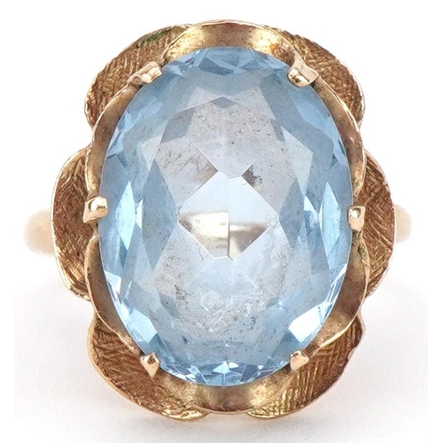 2130 - 9ct gold blue topaz flower head ring, the topaz approximately 16.20mm x 12.60mm x 7.0mm deep, size N... 