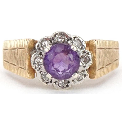 2244 - 9ct gold amethyst and diamond flower head ring with engine turned shoulders, size O, 3.7g