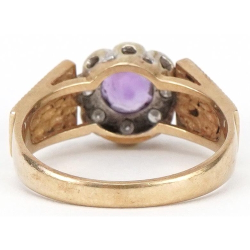 2244 - 9ct gold amethyst and diamond flower head ring with engine turned shoulders, size O, 3.7g