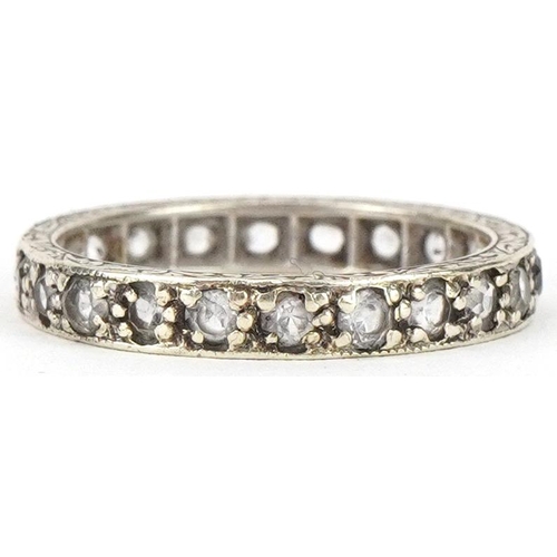 2242 - 9ct white gold clear spinel eternity ring engraved with foliage, size K/L, 2.0g