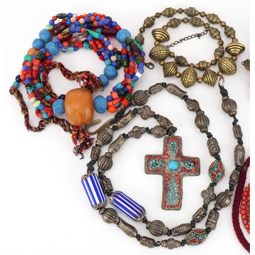 2716 - Five Asian and South American necklaces including amber coloured beads, coral and turquoise, the lar... 