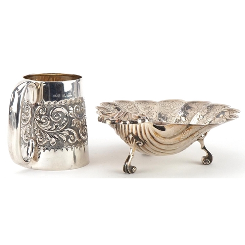 497 - Silver items comprising Victorian floral embossed christening tankard and a floral engraved shell sh... 