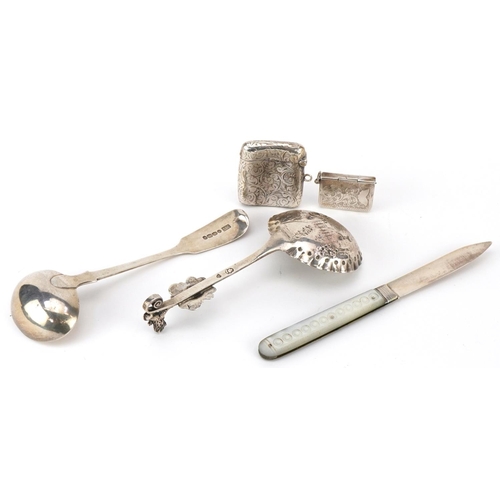 337 - Victorian and later silver comprising a Dutch silver caddy spoon embossed with a figure and child, l... 