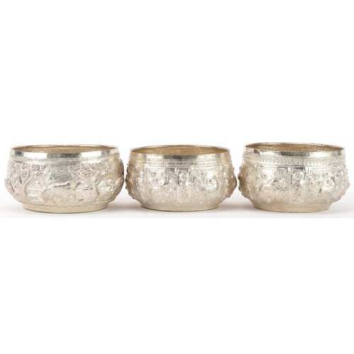 378 - Three Indian silver bowls embossed with wild animals, 10cm in diameter, total 216.2g