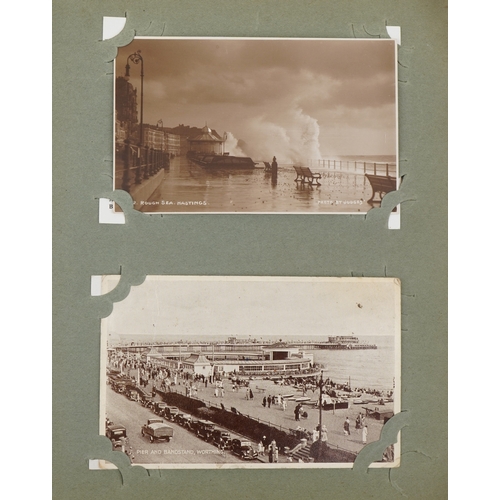 675 - Early 20th century and later postcards arranged in an album, some real photographic, including Croyd... 