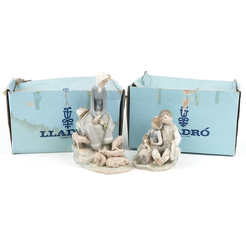 1164 - Two Lladro figure groups with boxes comprising  Figurine Precocious 4856 and girl with piglets 4572,... 