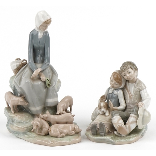 1164 - Two Lladro figure groups with boxes comprising  Figurine Precocious 4856 and girl with piglets 4572,... 