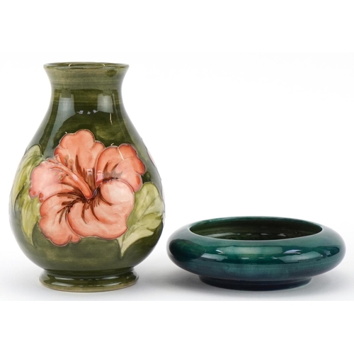 95 - Moorcroft pottery comprising a baluster vase hand painted and tubelined in the Hibiscus pattern and ... 