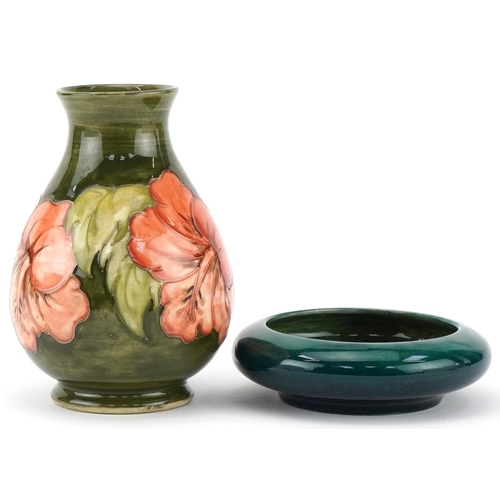 95 - Moorcroft pottery comprising a baluster vase hand painted and tubelined in the Hibiscus pattern and ... 