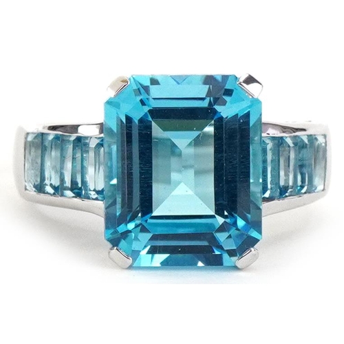9ct white gold blue topaz ring, set with blue stones to the shoulders, the topaz approximately 11.80mm x 9.60mm x 6.30mm deep, size L, 5.5g