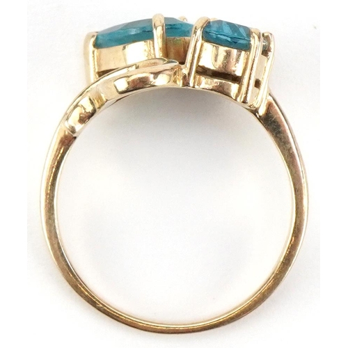 2338 - 9ct gold blue and pink spinel crossover ring, size N, 3.7g