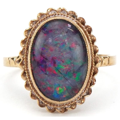 9ct gold cabochon opal ring, the opal approximately 12.80mm x 9.0mm x 3.80mm deep, size N, 2.7g