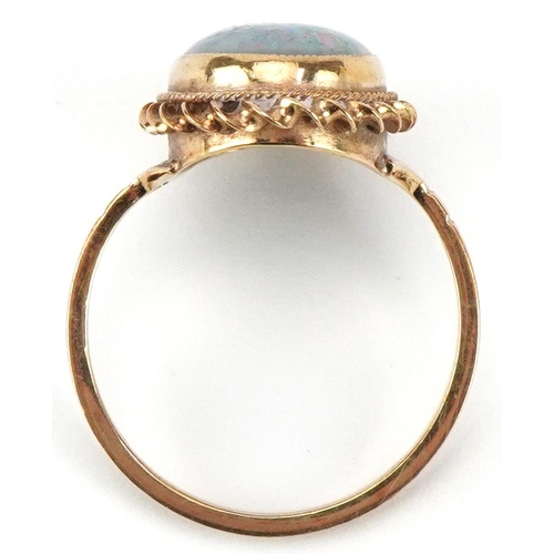 2376 - 9ct gold cabochon opal ring, the opal approximately 12.80mm x 9.0mm x 3.80mm deep, size N, 2.7g