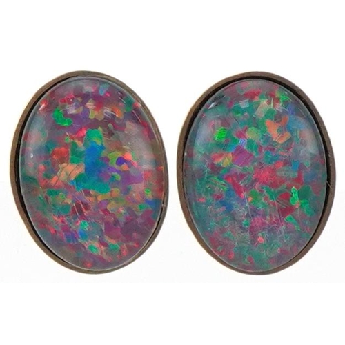 2217 - Pair of 9ct gold cabochon opal stud earrings, each 8.5mm high, total 1.2g