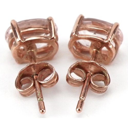 2335 - Pair of 9ct rose gold pink stone stud earrings, each 7mm high, total 1.1g