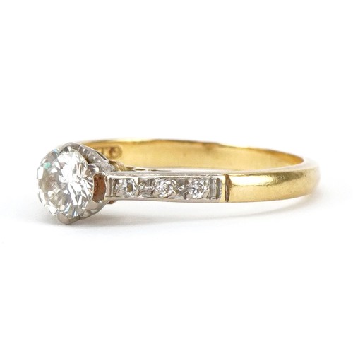 2041 - 18ct gold and platinum diamond solitaire ring with diamond set shoulders, the central diamond approx... 