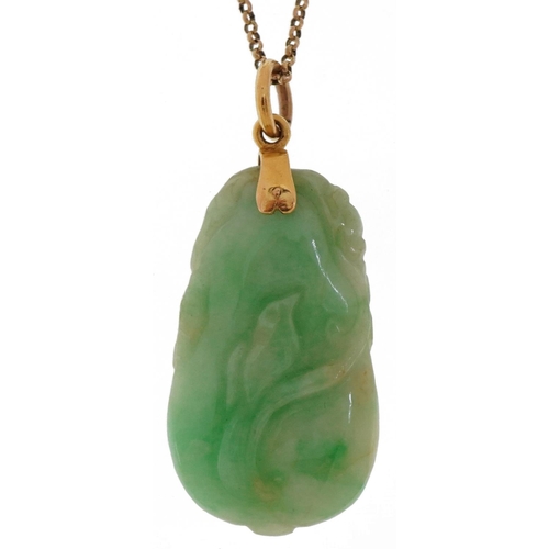 2314 - Chinese carved green jade pendant in the form of fruit with unmarked gold mount on a 9ct gold neckla... 