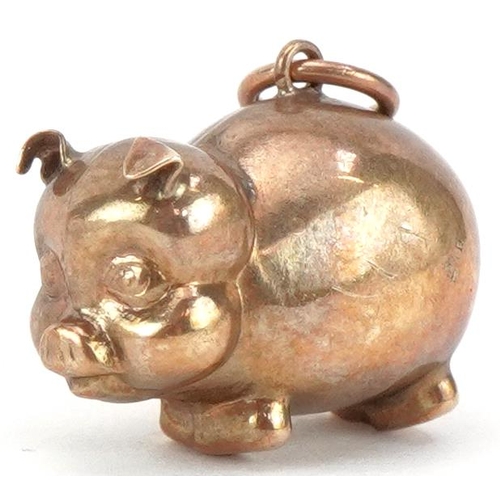 2236 - 9ct gold charm in the form of a comical pig, 1.9cm in length, 1.3g