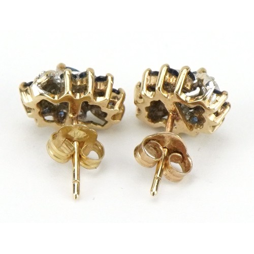 2285 - Pair of unmarked gold diamond and blue spinel cluster stud earrings, each 1.1cm high, total 2.1g