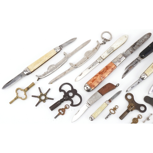 1349 - Folding pocket knives and various watch keys including mother of pearl flanked folding fruit knife w... 