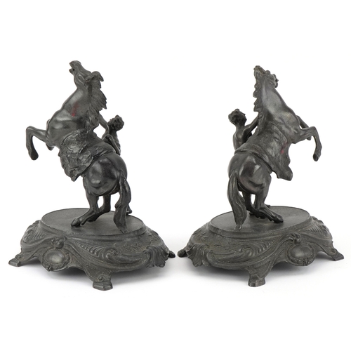 1325 - Pair of classical patinated spelter Marley horses with trainers, each 23.5cm high