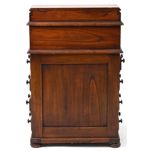 1055 - Stained hardwood Davenport with tooled leather top, fitted interior and four side drawers opposing f... 