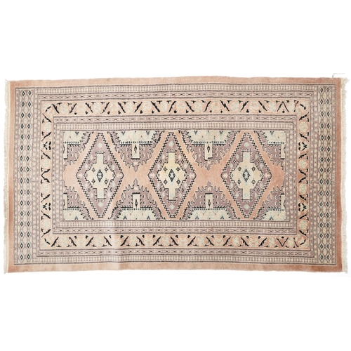 1125 - Middle Eastern beige ground rug having an allover floral design, 166cm x 97cm