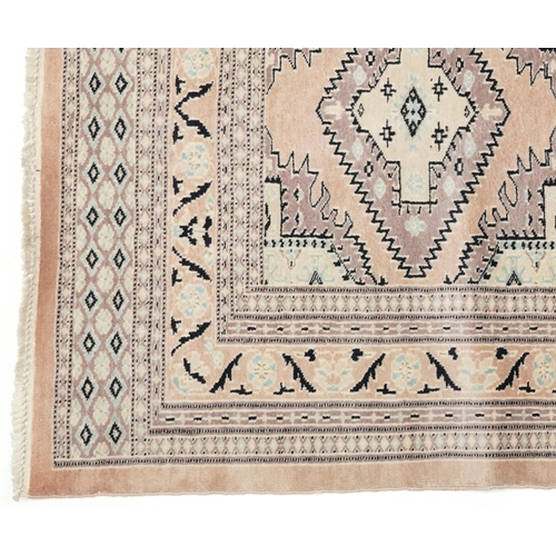 1125 - Middle Eastern beige ground rug having an allover floral design, 166cm x 97cm