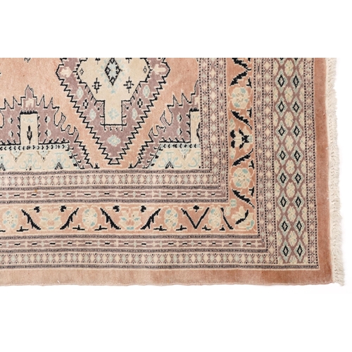 1125 - Middle Eastern beige ground rug having an allover floral design, 166cm x 97cm