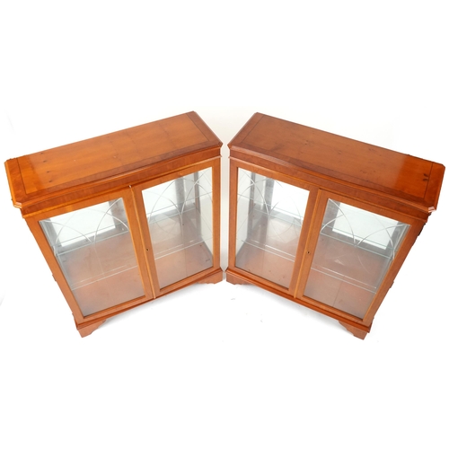 1052 - Pair of inlaid yew wood display cabinets, each fitted with two adjustable glass shelves, each 108cm ... 