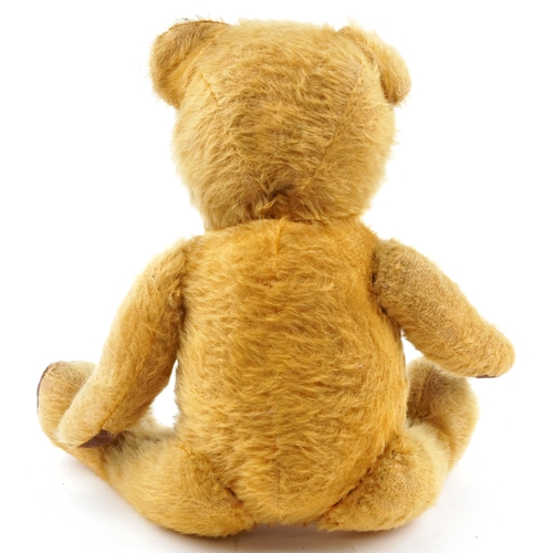 1521 - Early 20th century golden straw filled teddy bear with growler and jointed limbs, 44cm high