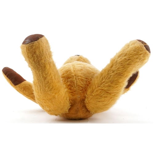 1521 - Early 20th century golden straw filled teddy bear with growler and jointed limbs, 44cm high