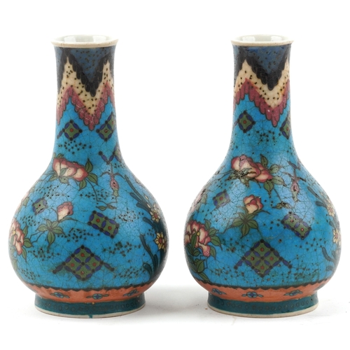 1296 - Pair of Japanese Owari shippo porcelain vases enamelled with flowers, each 19cm high