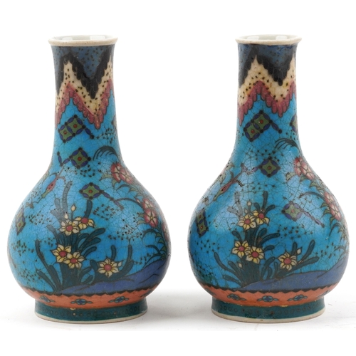 1296 - Pair of Japanese Owari shippo porcelain vases enamelled with flowers, each 19cm high