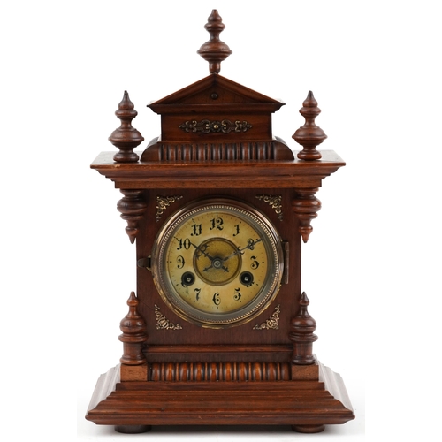 61 - Junghans architectural walnut mantle clock striking on a gong having circular chapter ring with Arab... 