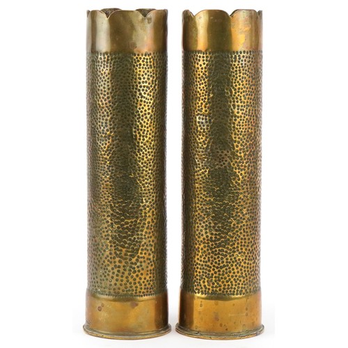 1765 - Pair of military interest World War I trench art shell cases embossed with flowers, each 31cm high