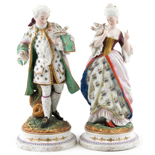 73 - Pair of large 19th century French bisque porcelain figures of bird catchers, impressed AM factory ma... 