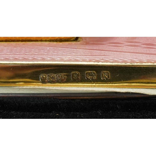 164 - Davis Moss & Co, Art Deco silver gilt and pink guilloche enamel manicure/vanity set housed in a velv... 