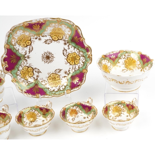 77 - Victorian teaware hand painted and gilded with flowers, seven cups, slop bowl and side plate, the la... 