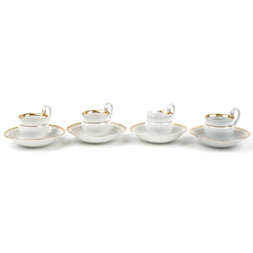 72 - Four Meissen porcelain chocolate cups and saucers with swan neck handles each saucer 14.5cm in diame... 