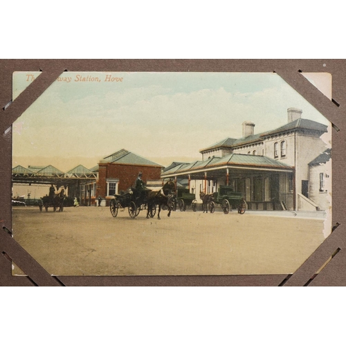 673 - Local interest and railwayana postcards arranged in an album including Eastbourne Railway Station an... 