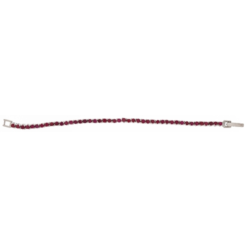 2181 - Silver ruby line bracelet, each ruby approximately 2.80mm in diameter, 18cm in length, 15.0g