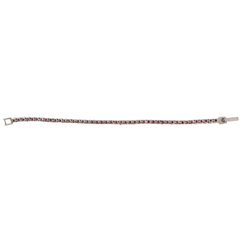 2181 - Silver ruby line bracelet, each ruby approximately 2.80mm in diameter, 18cm in length, 15.0g