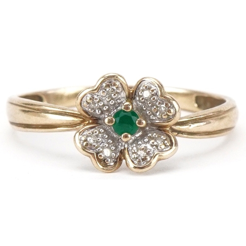 2124 - 9ct gold diamond and emerald flower head ring, size S/T, 1.5g