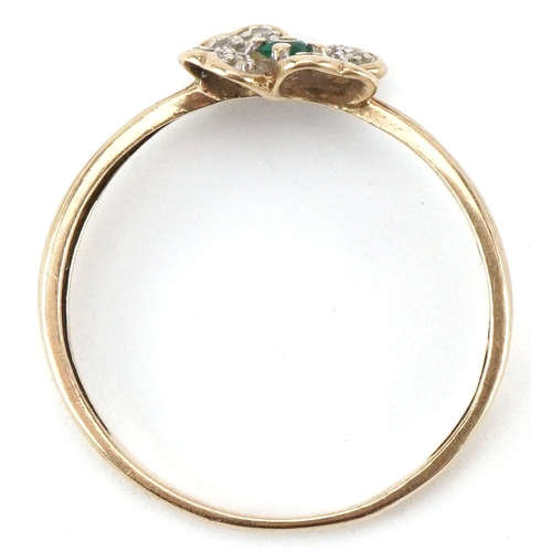 2124 - 9ct gold diamond and emerald flower head ring, size S/T, 1.5g