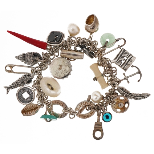 Links of London, silver charm bracelet with a collection of charms including sea shells, buttons, bottle cap and safety pin, 16cm in length, 74.4g