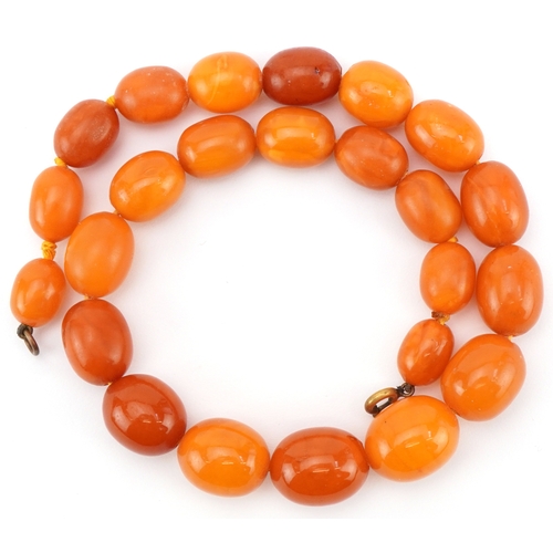 2021 - Butterscotch amber coloured graduated bead necklace, the largest bead approximately 18mm x 15mm in d... 