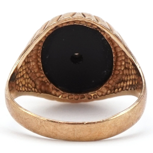 2424 - 9ct gold black onyx signet ring set with a clear stone, size R, 5.0g