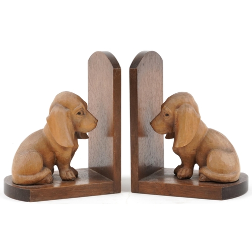 Pair of Art Deco mahogany and lightwood carved dog design bookends, each 18cm high