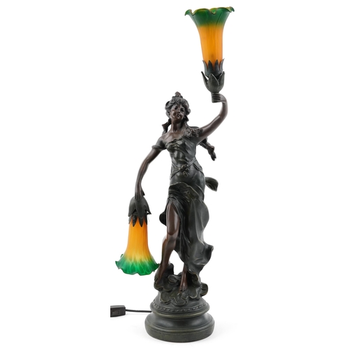 234 - After A Moreau, French style bronzed table lamp in the form of an Art Nouveau female with two orange... 